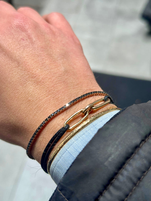 Tennis Bracelet: Black Diamonds, 18 Karat Gold